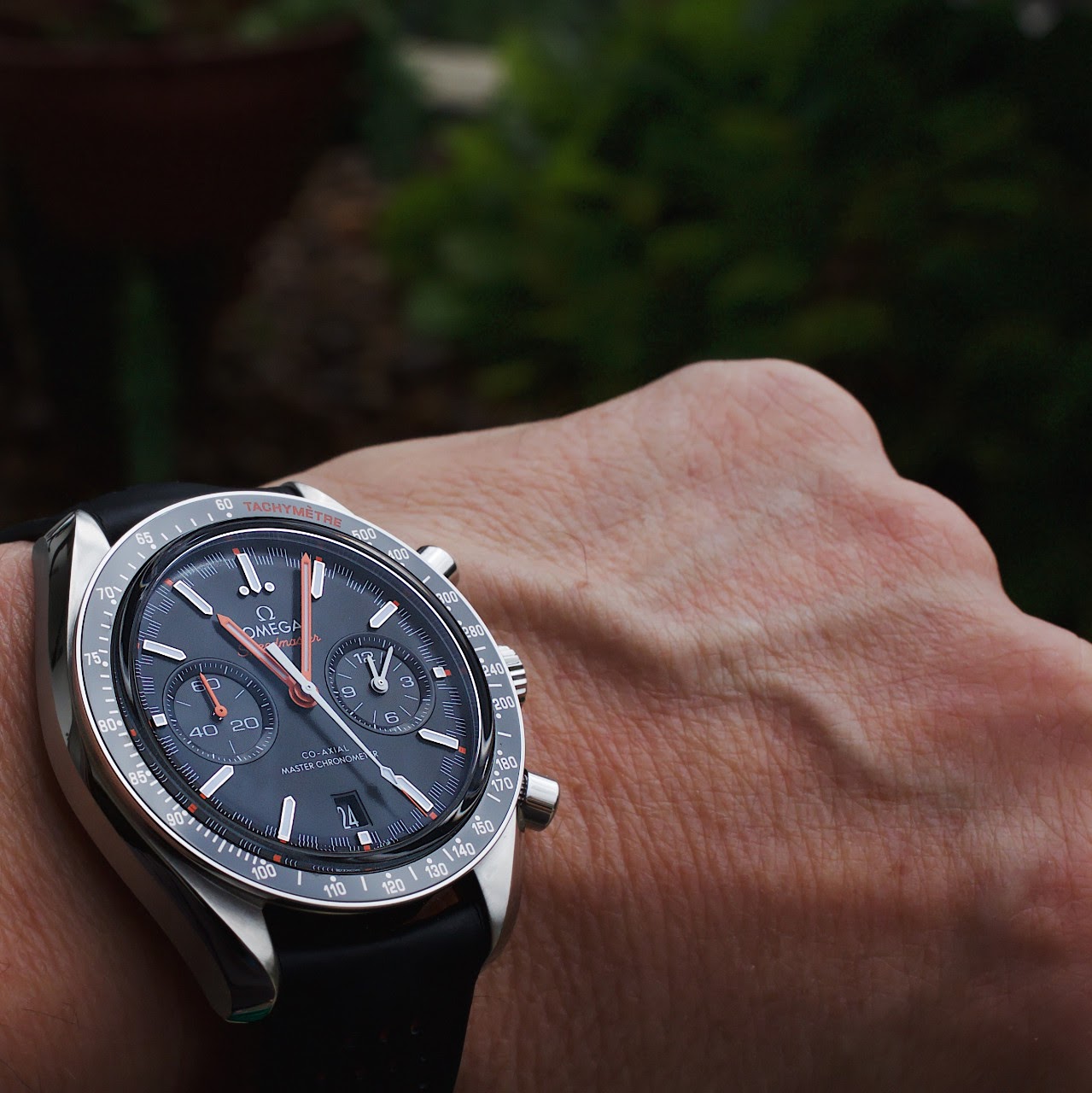 omega speedmaster racing on wrist