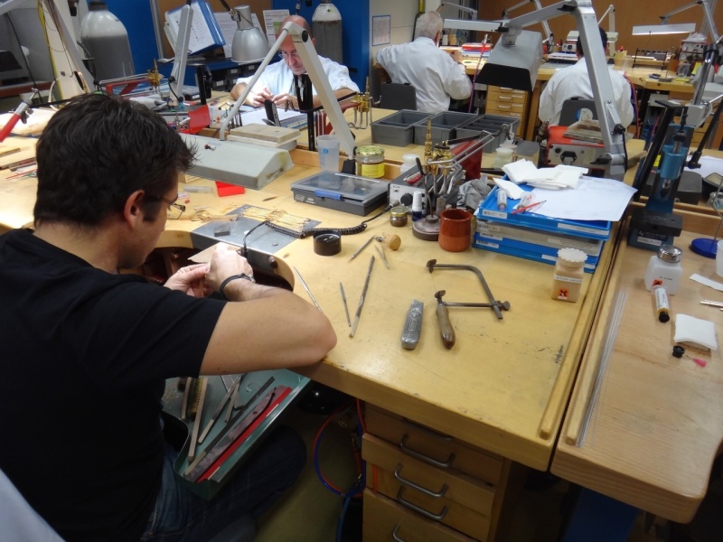 A craftsman working on the bracelet