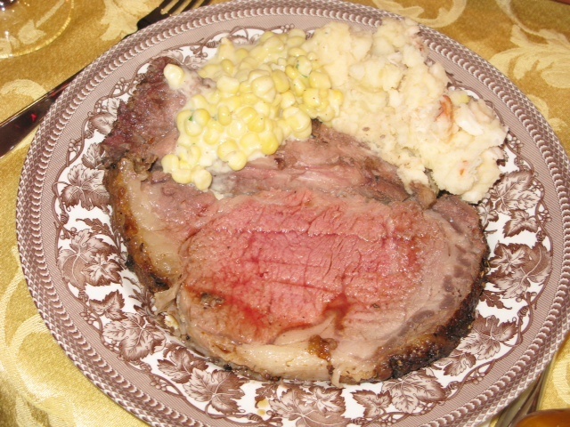 Prime rib with creamed corn and lobster mashed potatoes.