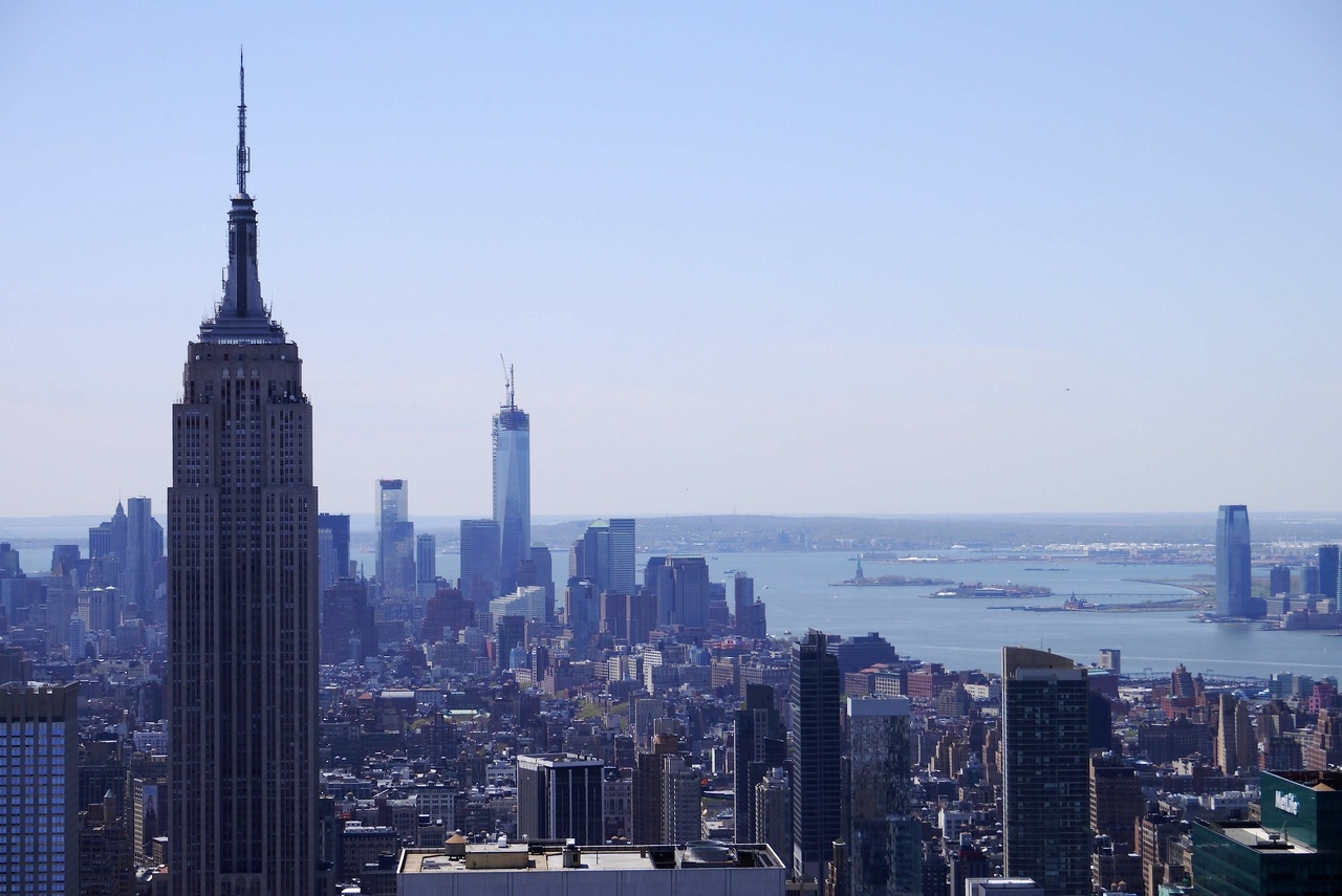 Empire State Building on the left with Statue of Liberty in the far right