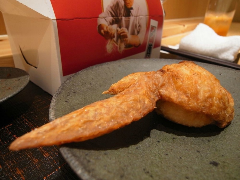 It's DFC (den fried chicken). Wing filled with rice and ume. To busy eating, forgot to take picture of the filling