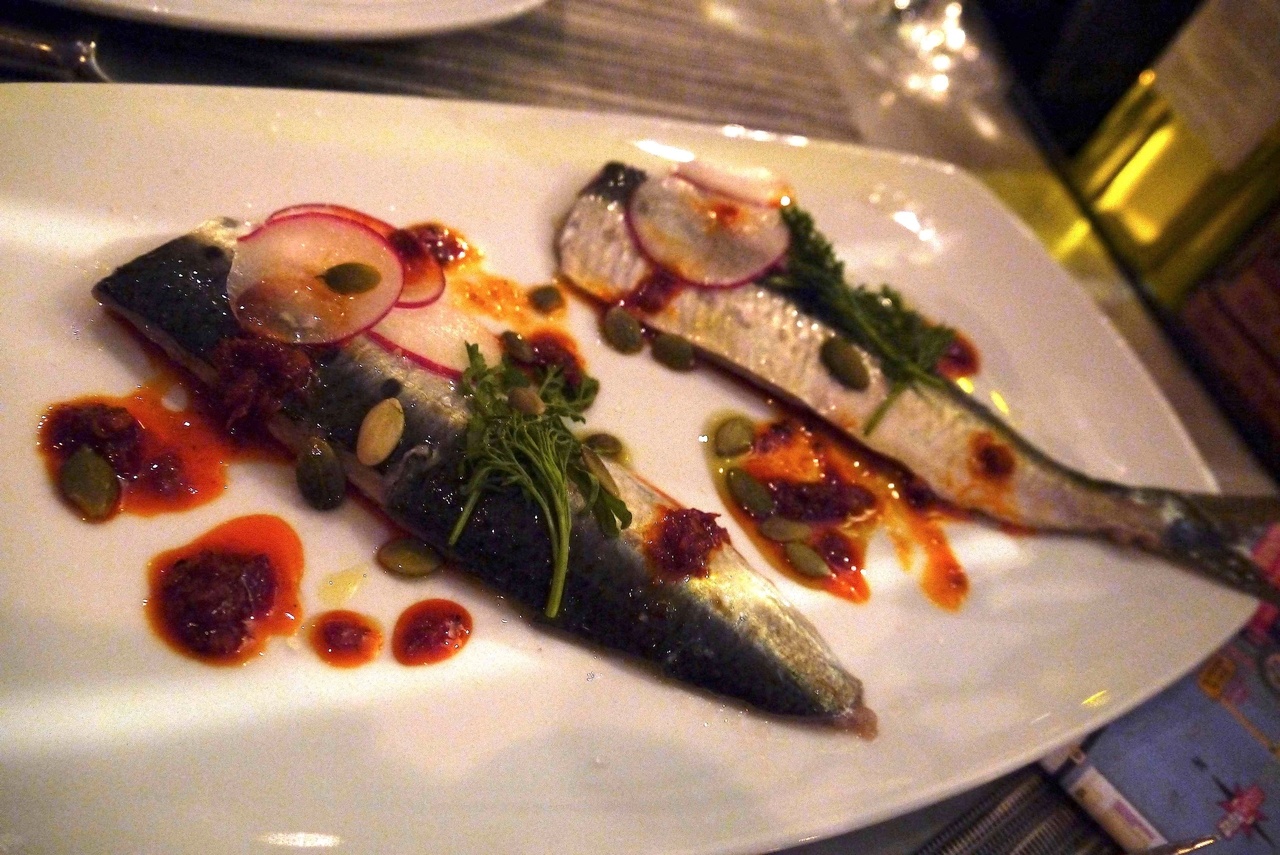 Half moon bay sardines with pumpkin seeds,shaved radishes,pepper cress and Calabrian Chilli oil