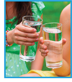 Image of two adolescents with glasses of water