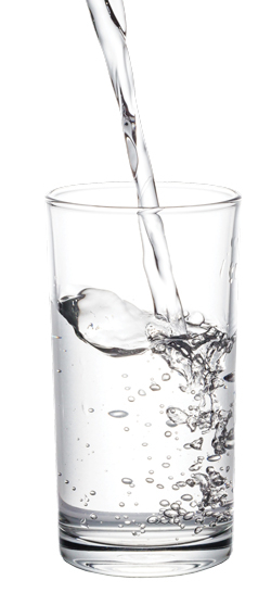 Clean drinking water piping into a glass.