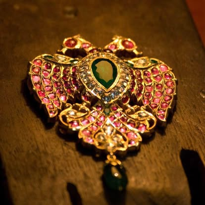 Handpicked temple jewelry — gold and ruby kemp pendant to complete the look