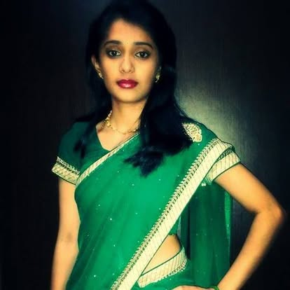 Emerald green saree with gold border — timeless elegance for every occasion