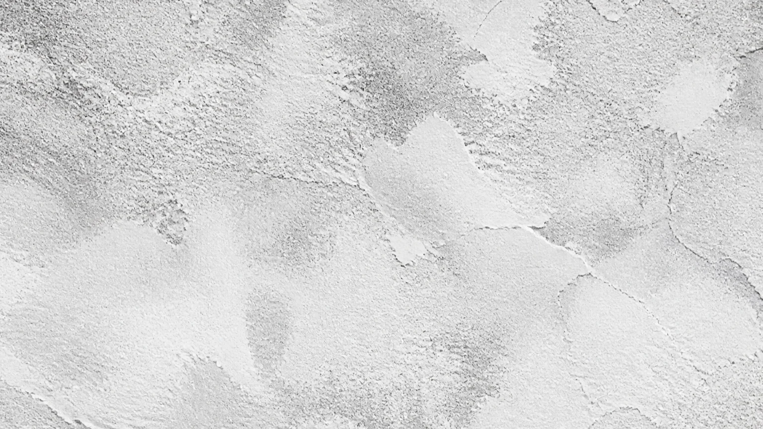 Abstract monochrome mineral-plaster texture with graphite pores and fine fissures