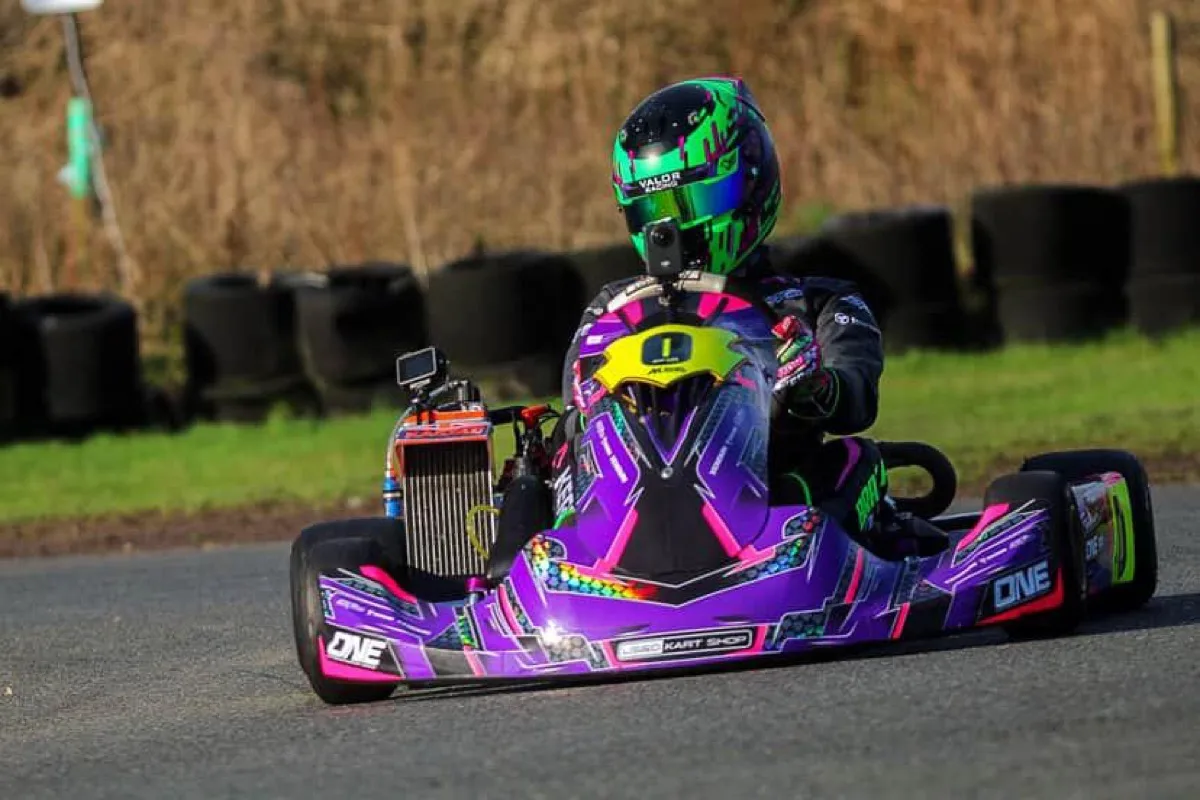 Kart racer on track with GoPro camera mounted