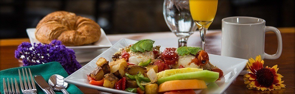 breakfast plate with orange juice and coffee