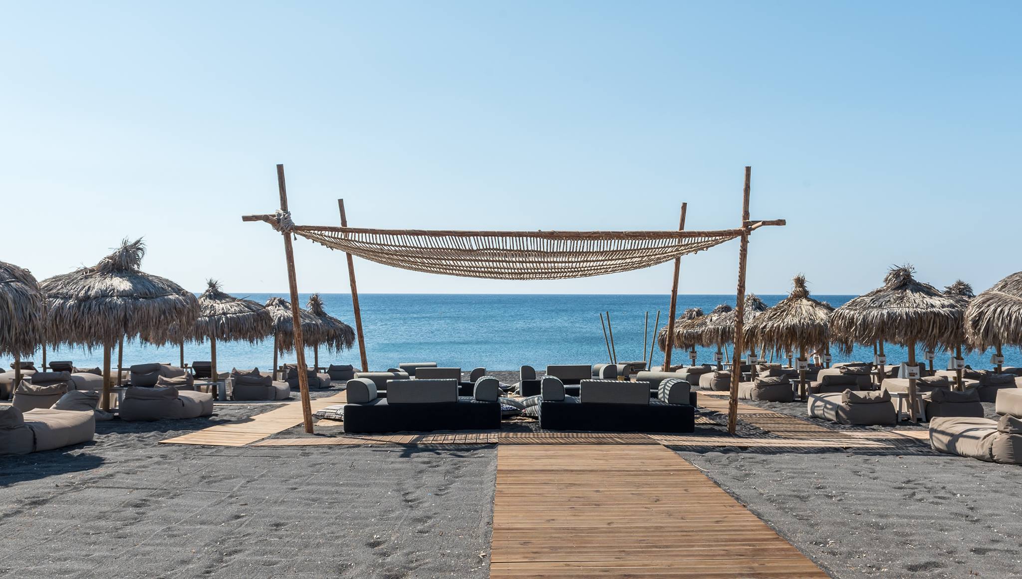 Top Must-Visit Beach Clubs In Santorini - Wet Stories  Santorini