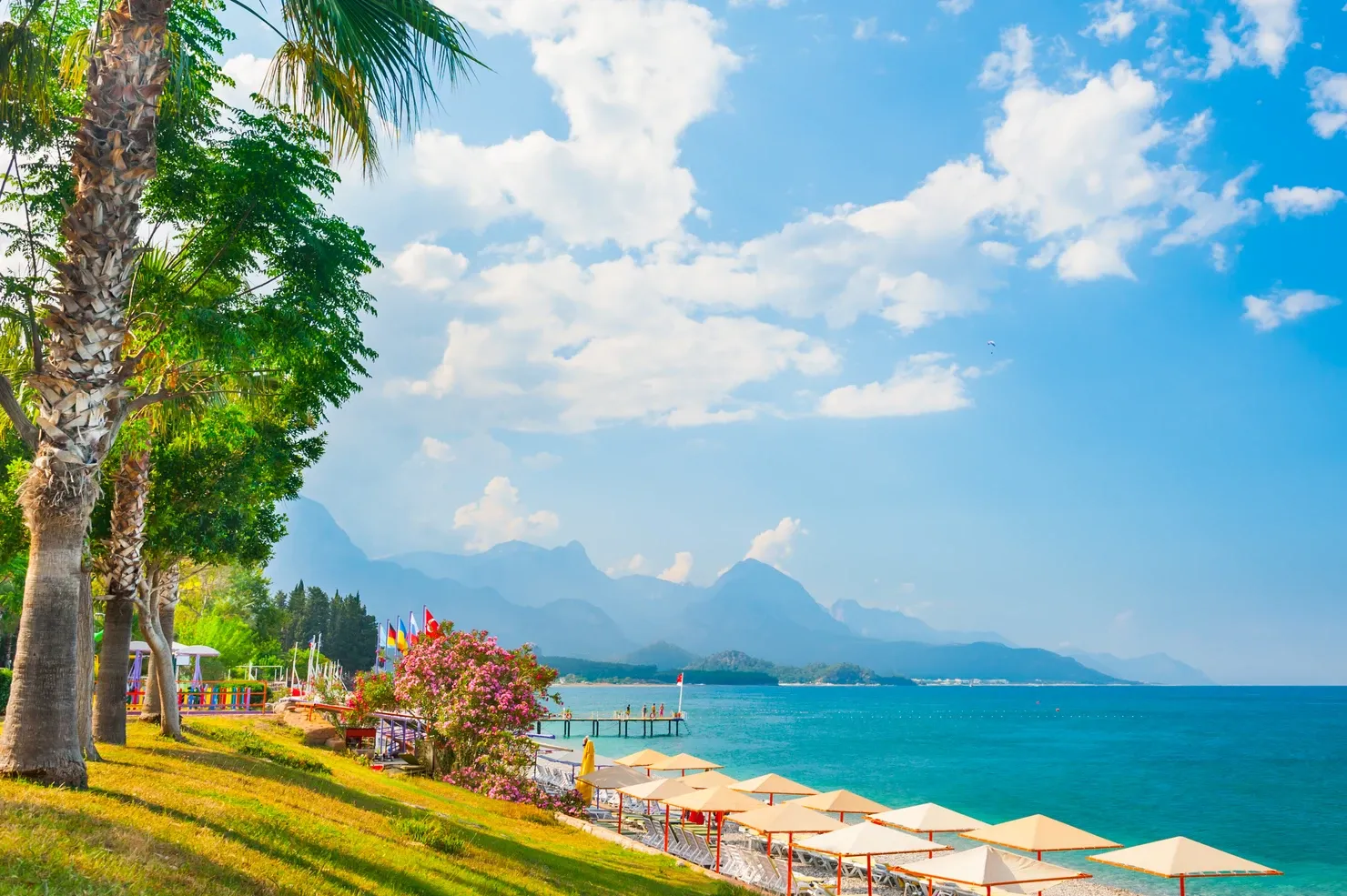 Beautiful beach with green trees in Kemer, Turkey