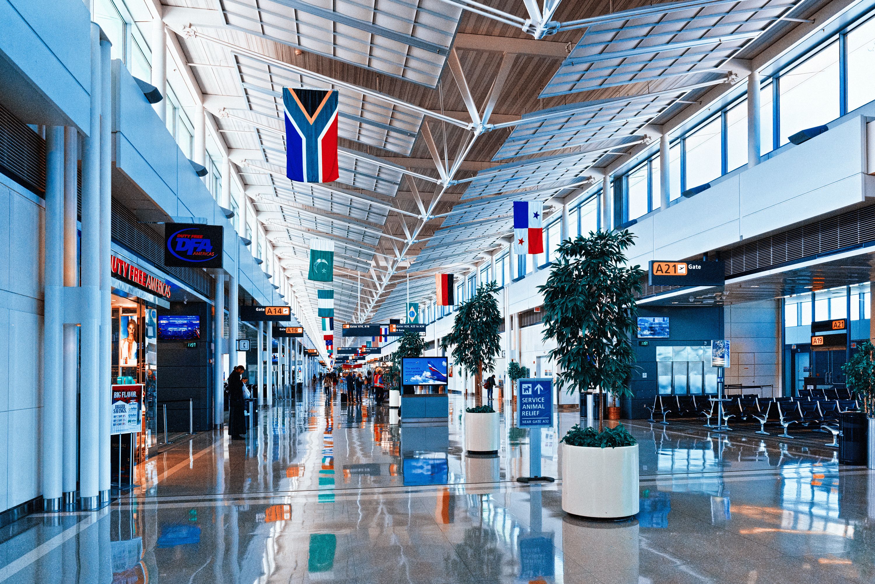 inside Dulles International Airport with people and tourists.