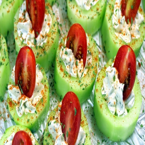Cucumber Bites with Herb Cream Cheese and Cherry Tomatoes.