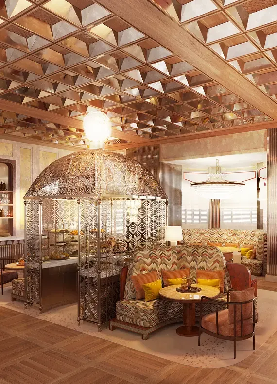 A luxurious lounge with a dome-shaped woven structure, plush seating, and a patterned ceiling.