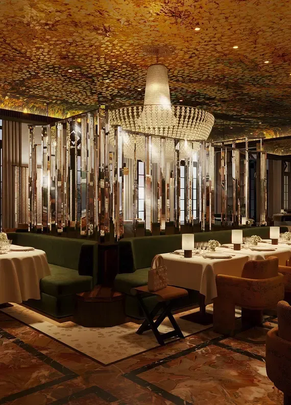 Luxurious restaurant interior with an ornate chandelier and reflective wall panels.