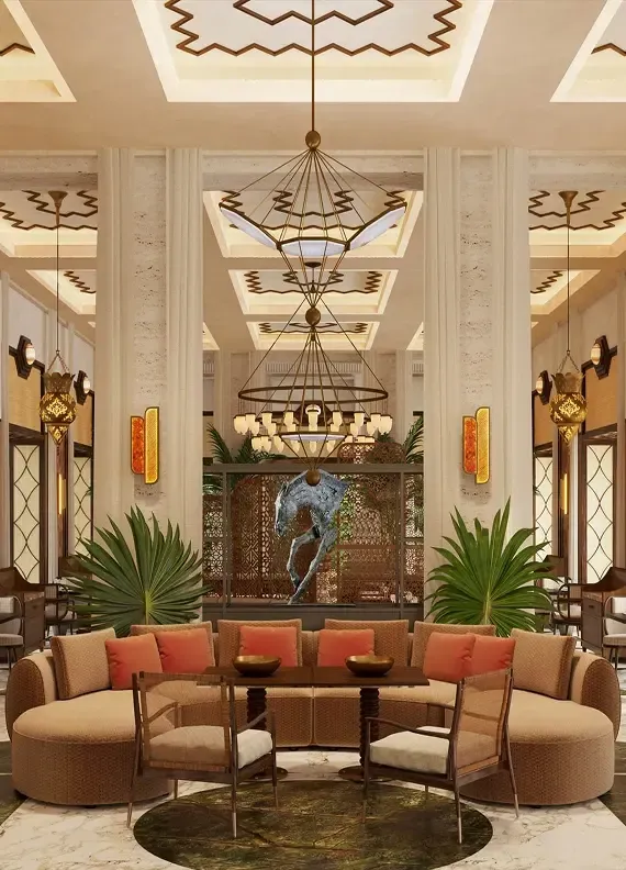 Luxurious hotel lobby with elegant circular seating, ornate chandeliers, and decorative ceiling patterns.