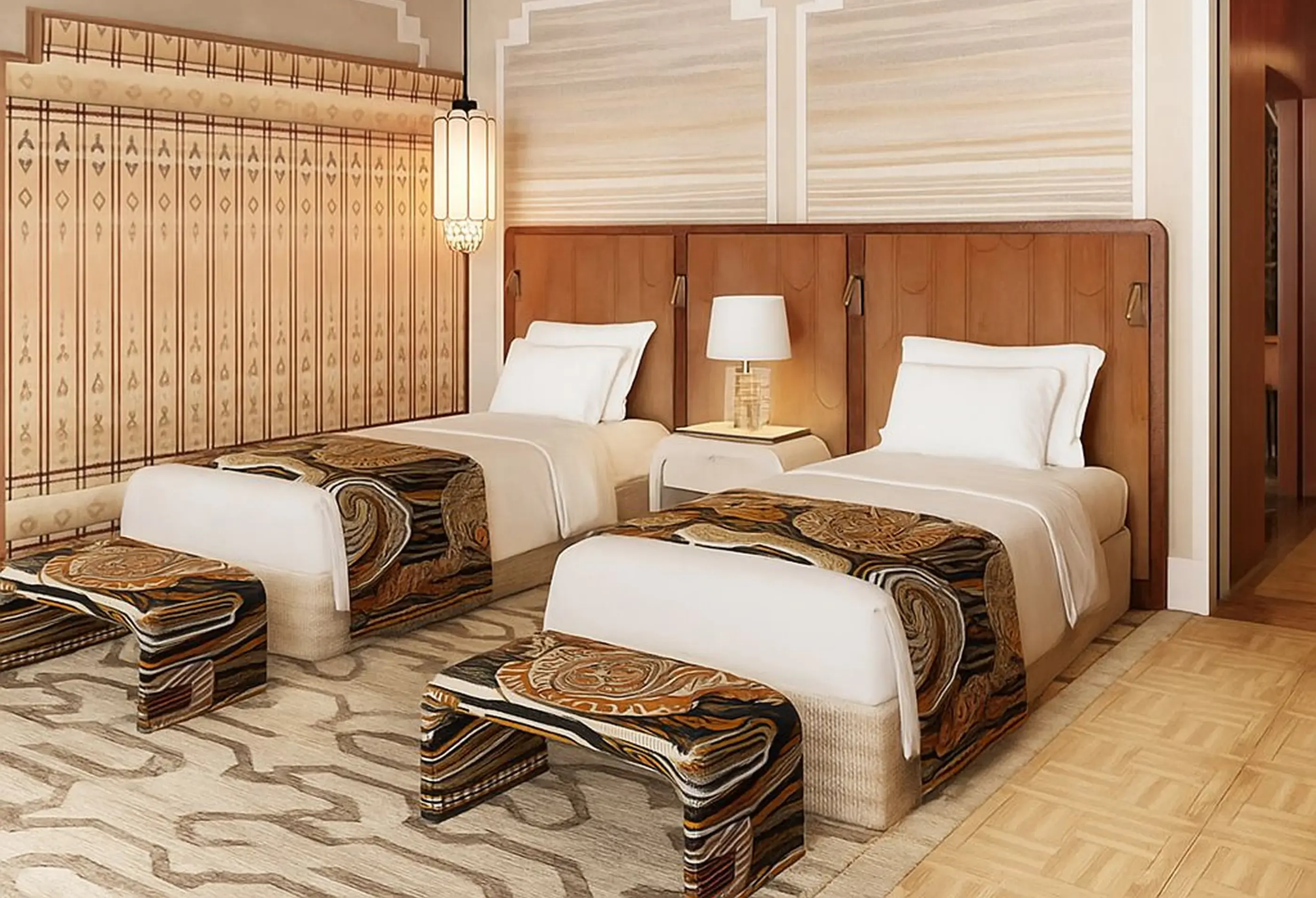 An elegant hotel room features two twin beds with patterned throws and a decorative lamp.