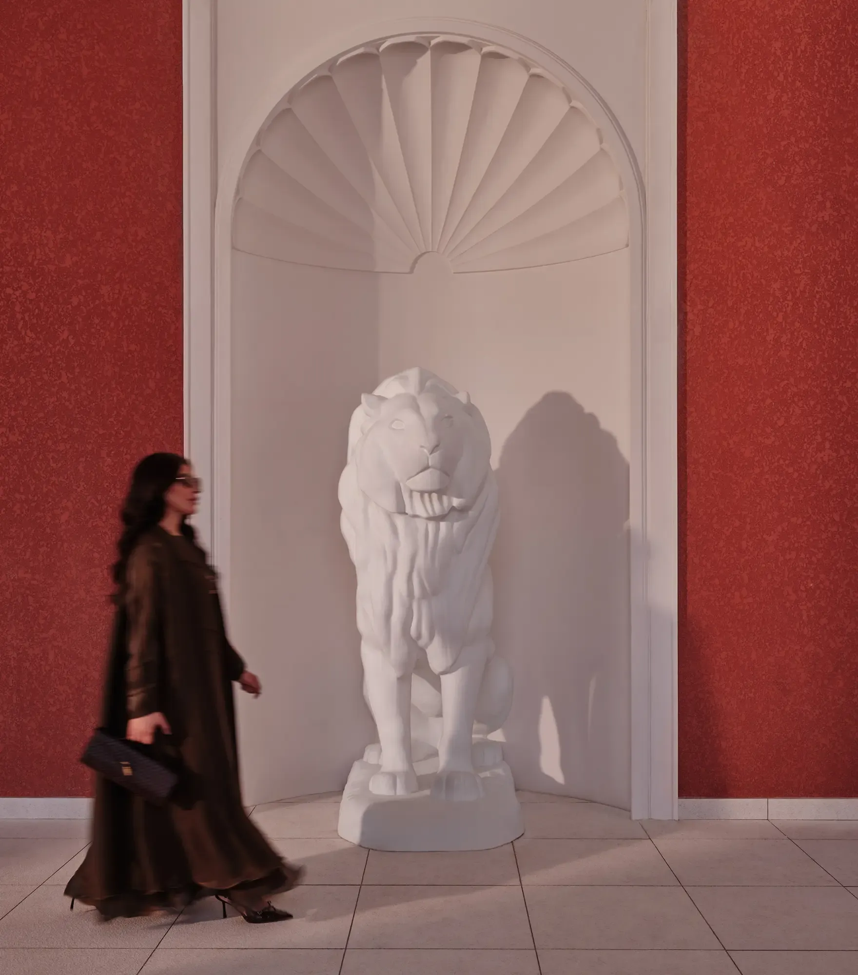 arched walls with white statue 