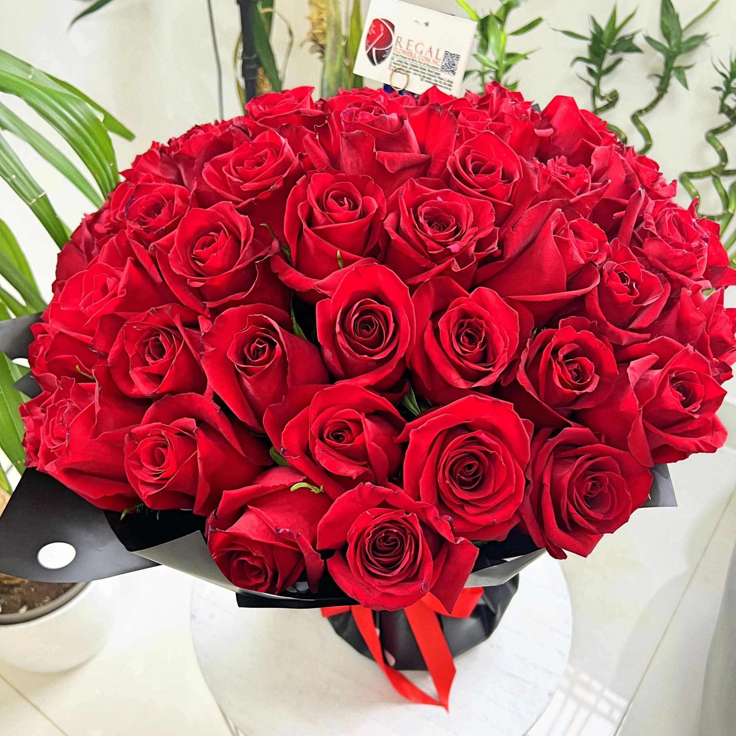 https://storage.googleapis.com/regalflowers-cdn/img-2016-11-Regal-Red-Roses-Bouquet-Red-Roses-Flowers_11zon-scaled.jpg