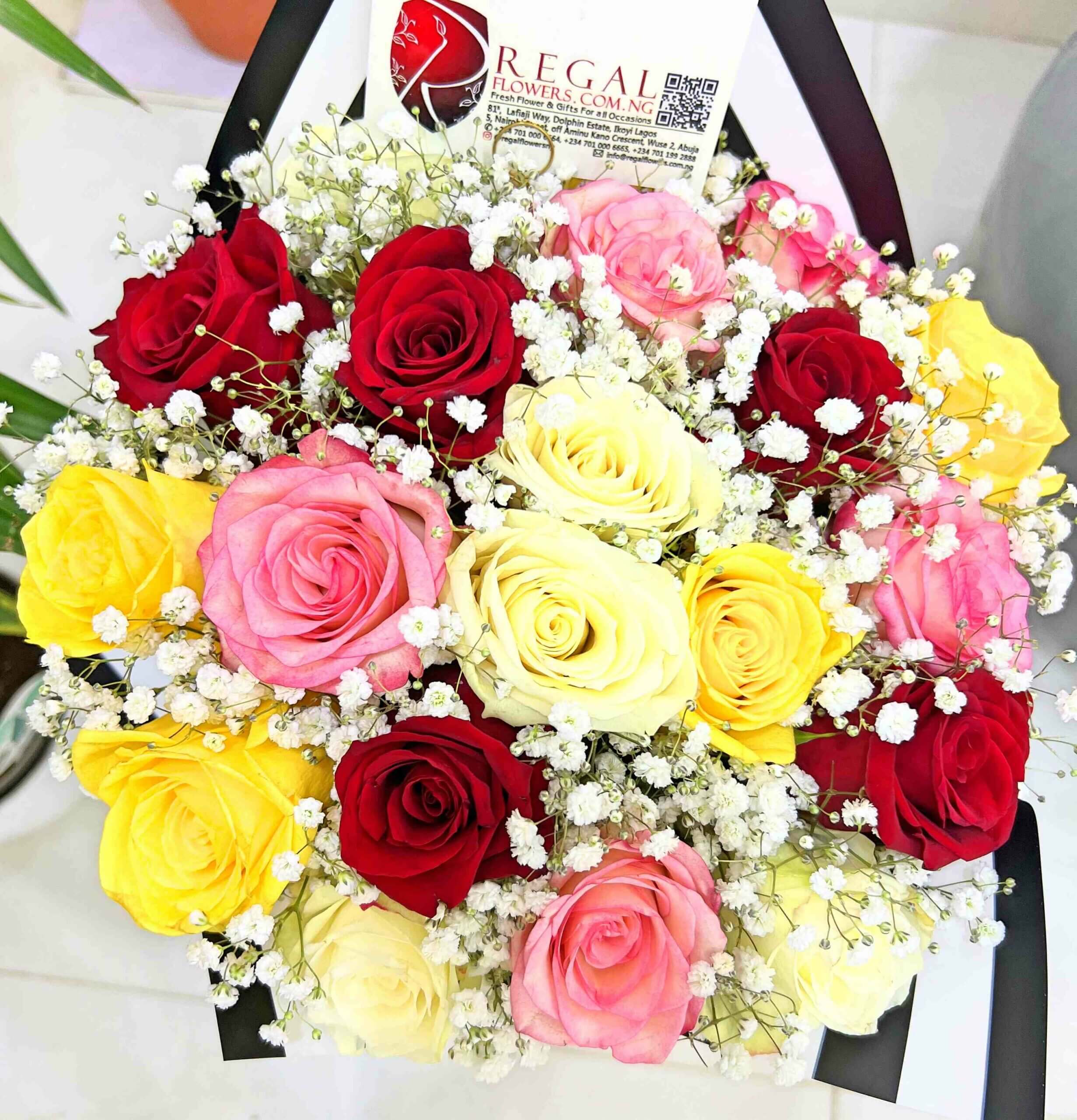 Regal White Roses, Yellow Roses , pink Roses and Milliobn Stars