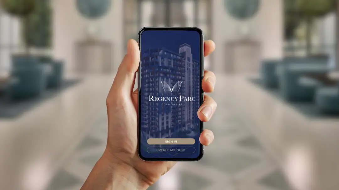 Hand holding a phone with the regency park app showing