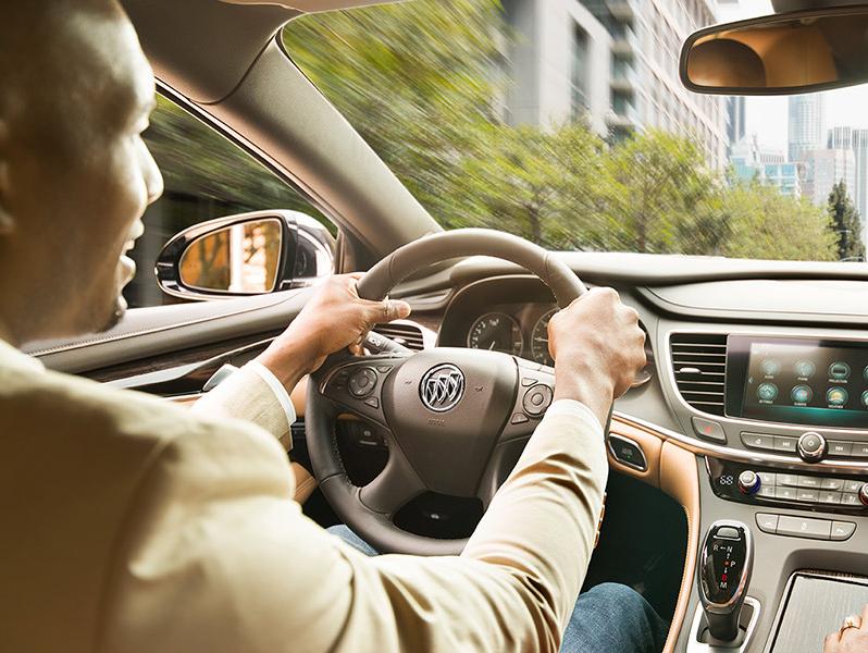 Man driving Buick