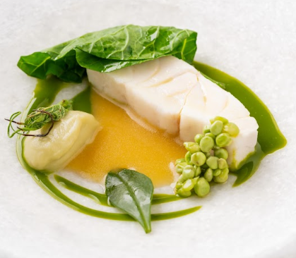 A carefully plated fine dining fish course