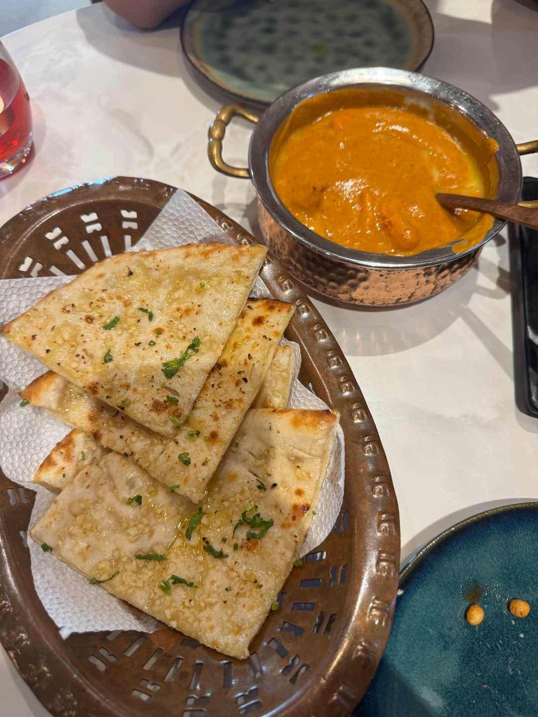 Naan bread with butter and Butter Chicken