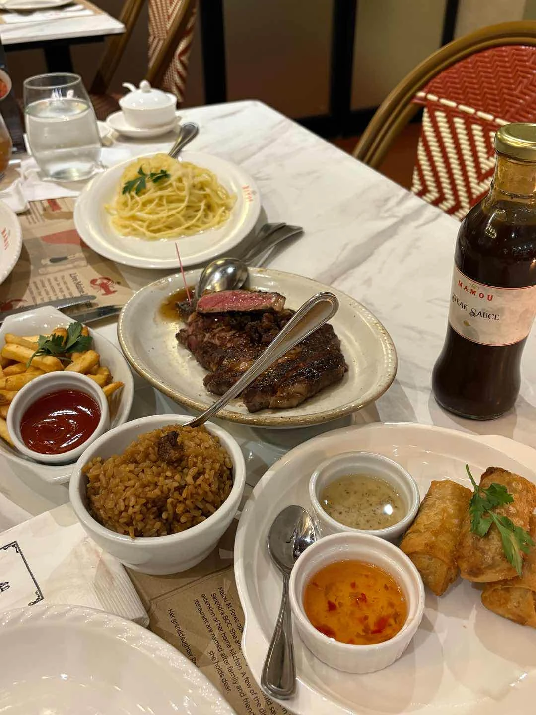 single ribeye, lorenzo’s truffle pasta, tofu + tinapa soring rolls