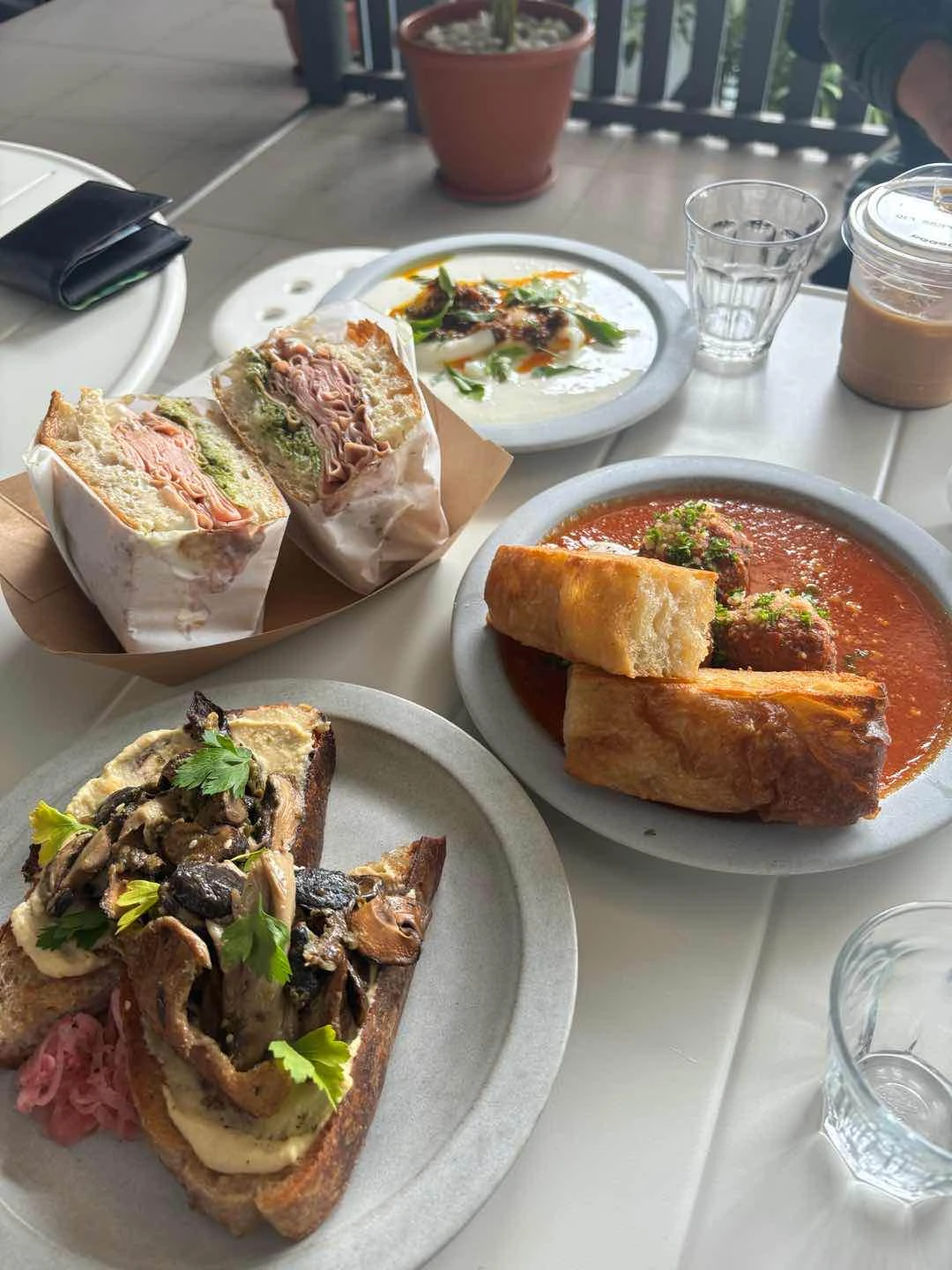 turkish eggs, mushroom toast, mortadella sandwich, meatballs