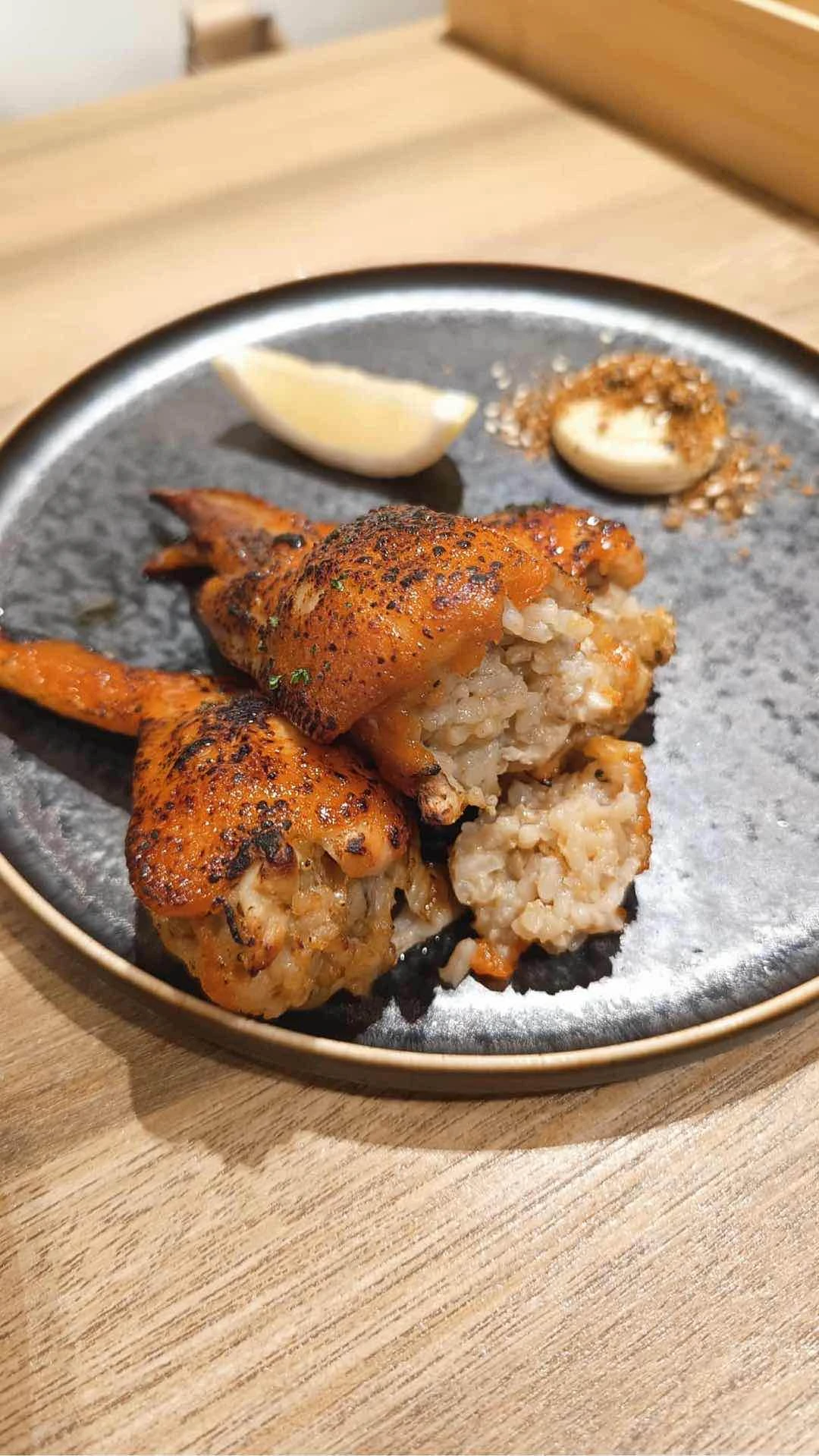 Chicken wings stuffed with rice, shiso and sesame