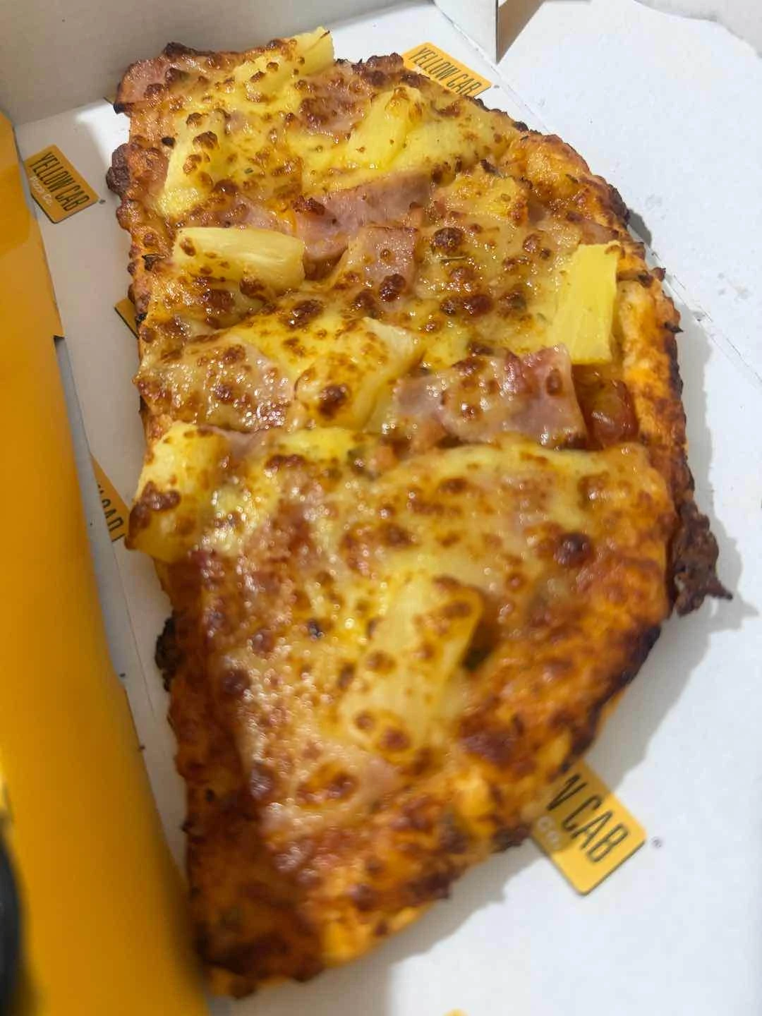 Half Hawaiian Pizza of Yellow Cab Pizza