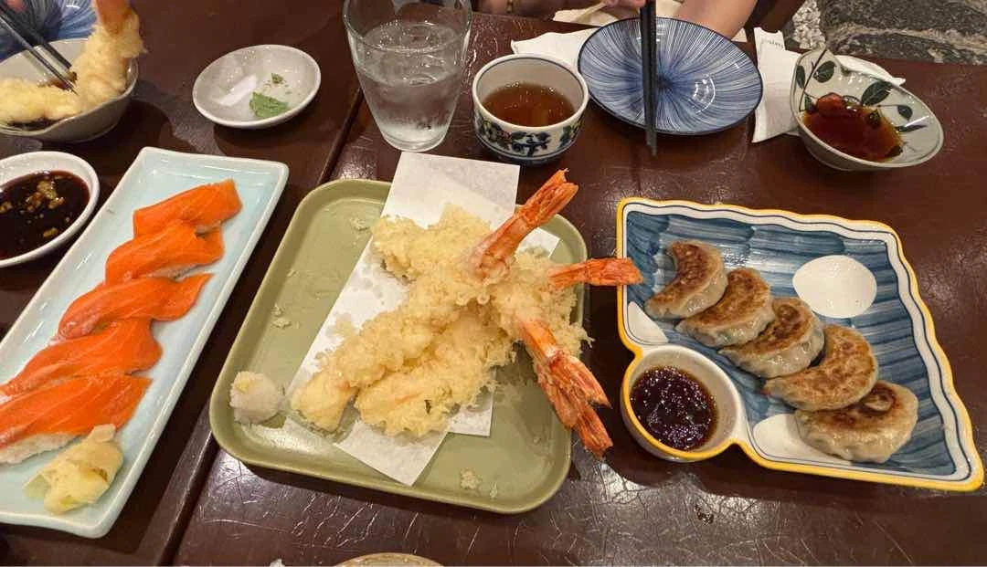gyoza, tempura, salmon sashimi