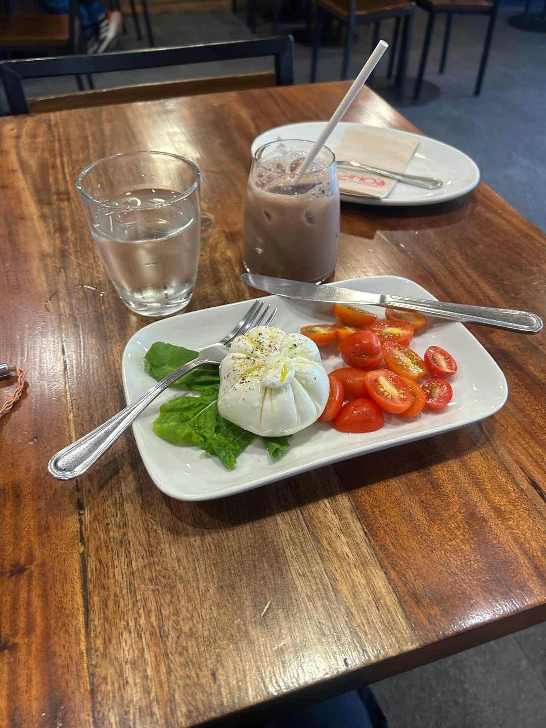 Burrata with extra cherry tomatoes of Gino's Brick Oven Pizza Katipunan Ave