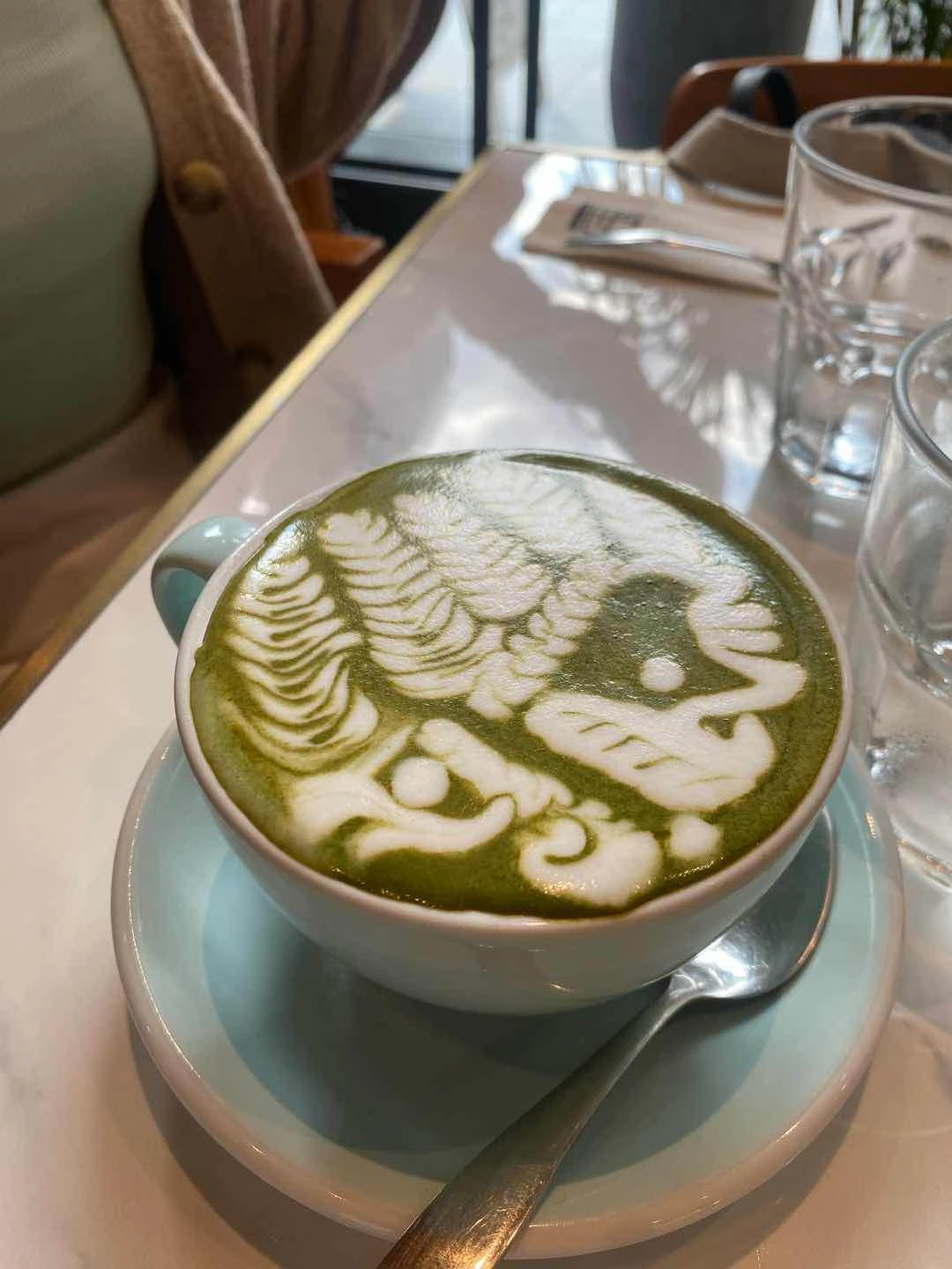 Hot matcha latte of The Fat Seed Cafe + Roastery One Ayala