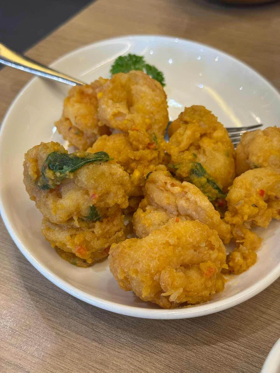 crispy crystal prawns tossed with salted egg yolk