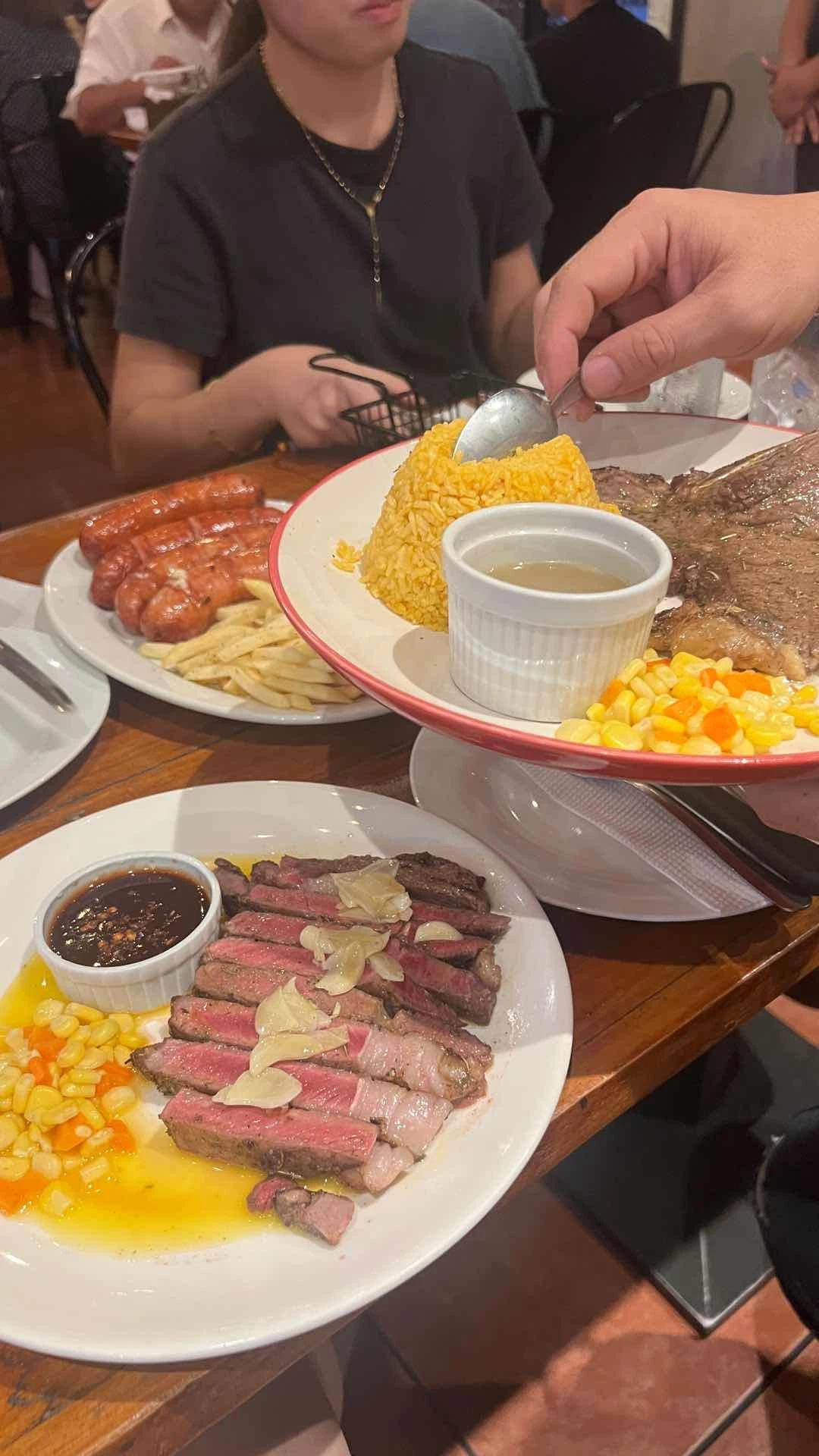 Grass fed rib eye, hungarian sausage platter, porterhouse with rice