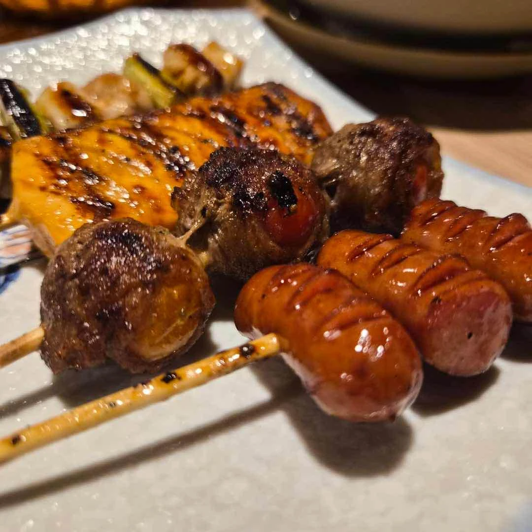 Skewers (salmon, tomato bacon, chicken and leeks, Japanese sausage)