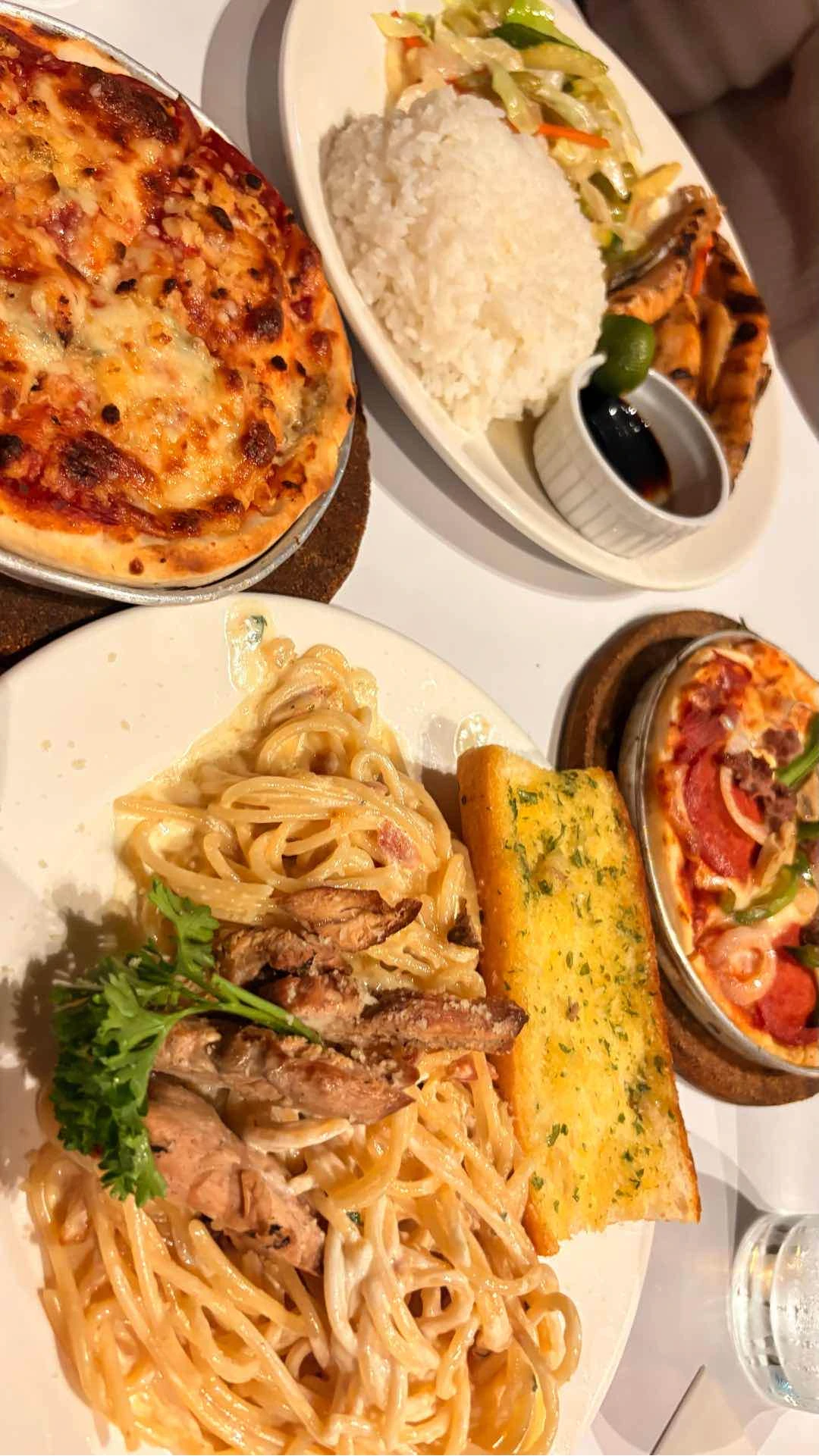 Grilled Salmon, Alfredo, and their bestseller pizzas