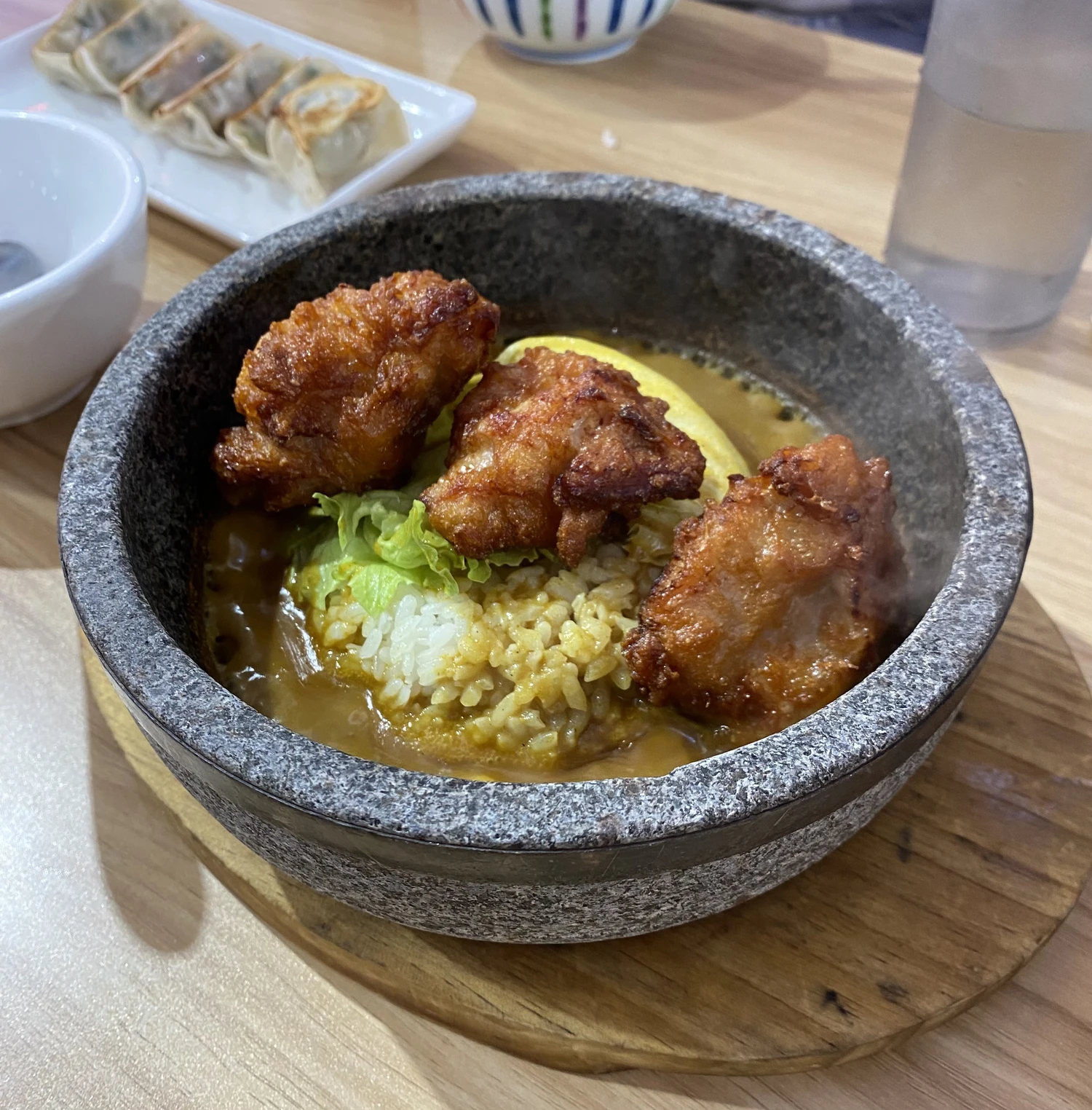 Karaage + curry served in hot stone 9/10.