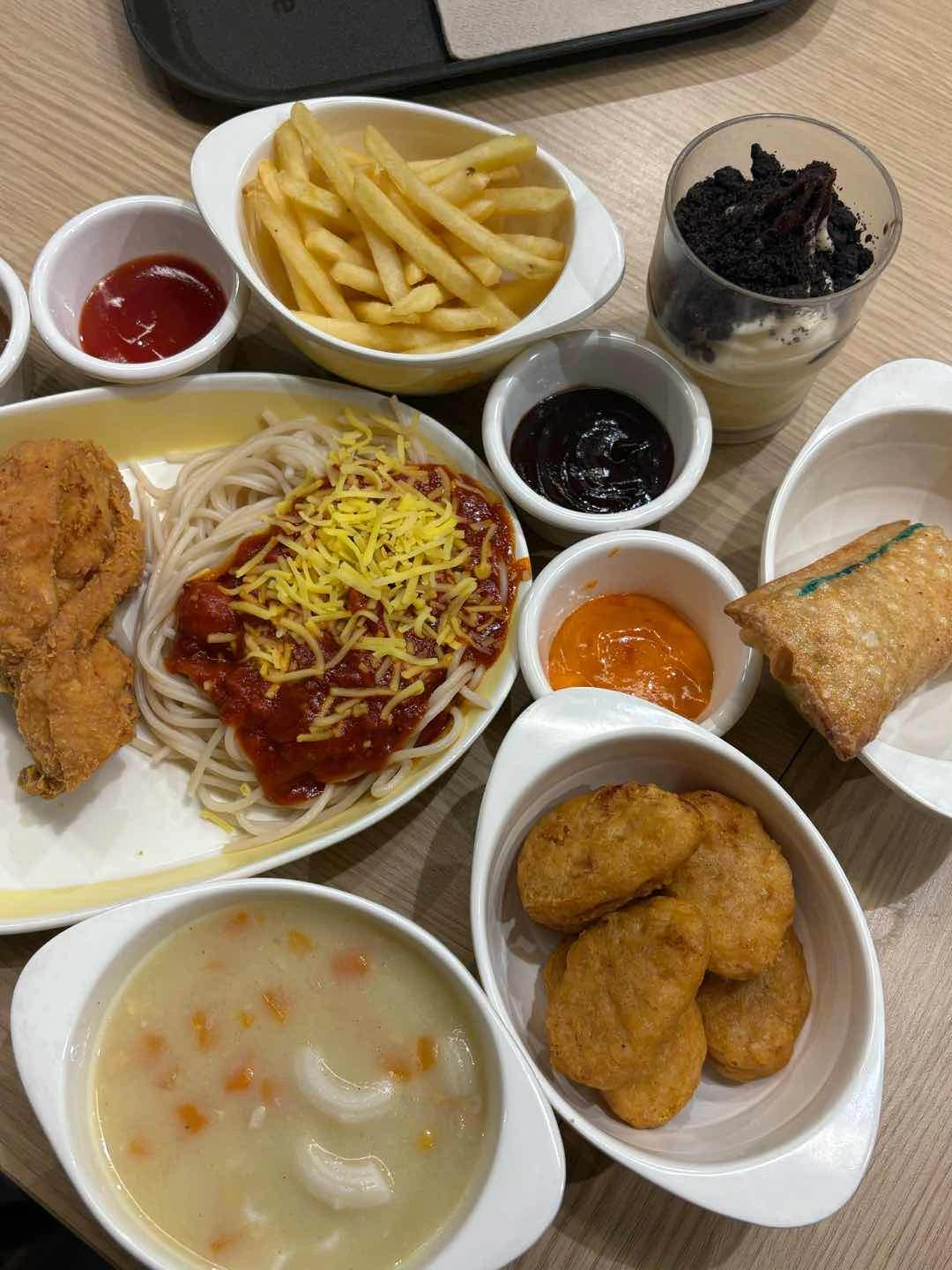 chickenjoy + spag, fries, macaroni soup, nuggets, tuna pie, and cookies and cream sundae