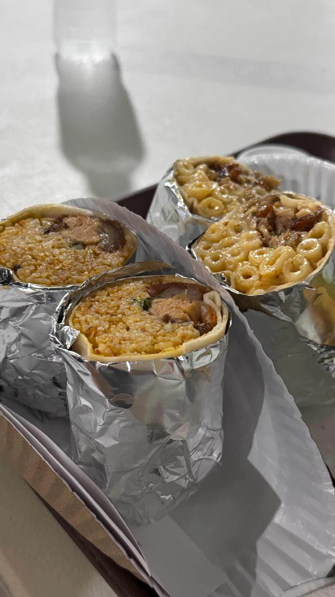 Left is Kare Kare Buritos, Right is Chicken Mac and Cheese Wrap.