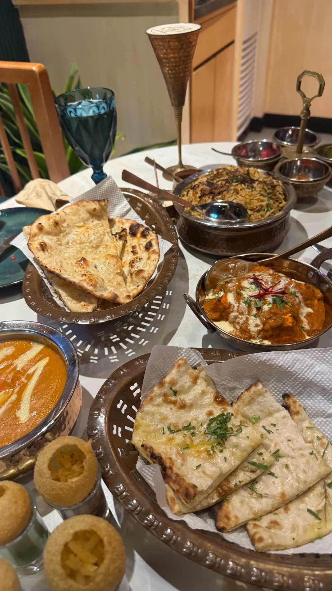 butter chicken, garlic and cheese naan, paneer, biryani, pani puri of Swagat at Rada
