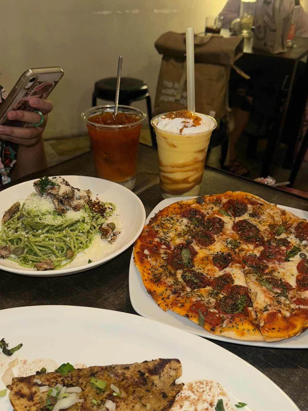 pepperoni pizza, birria tacos, malunggay pesto (i think) drinks are thai milk tea and mango biscoff