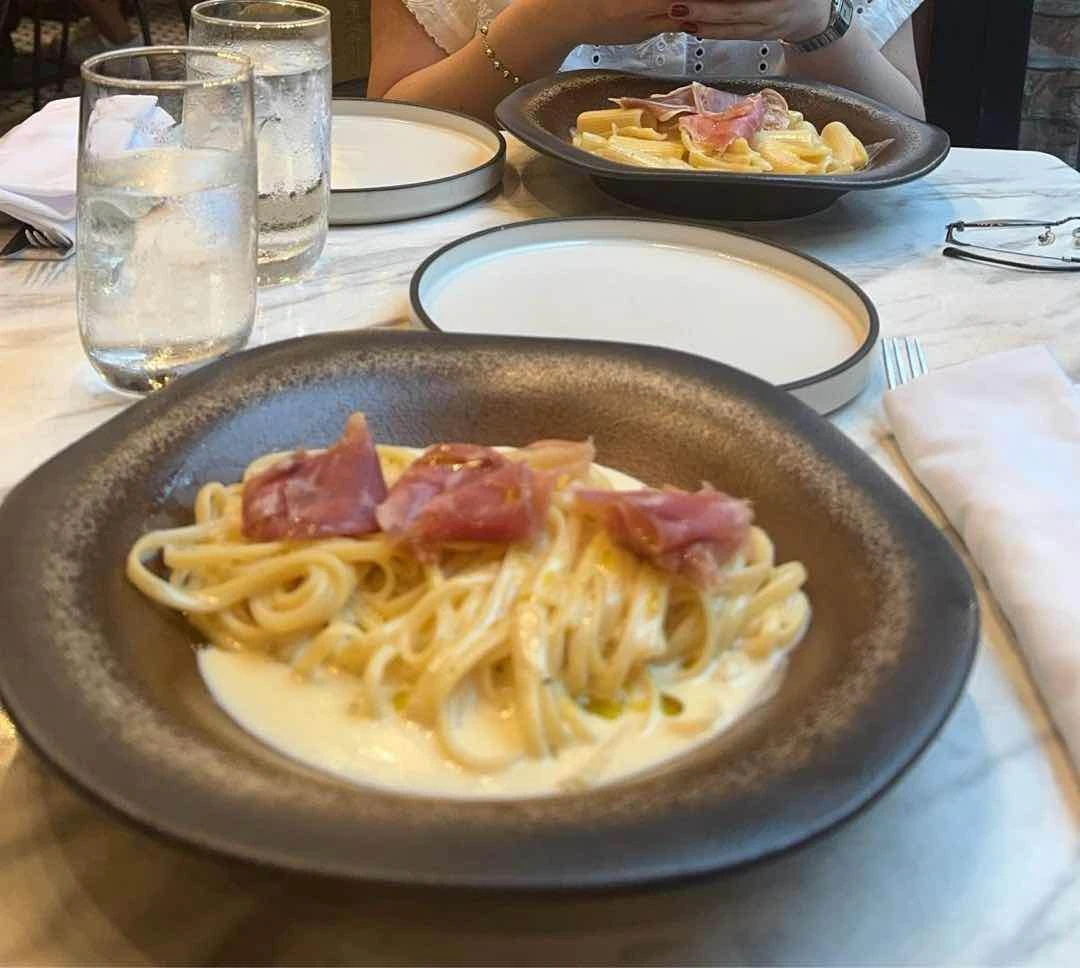 Chef's Pasta Flambeed in Cheese Wheel