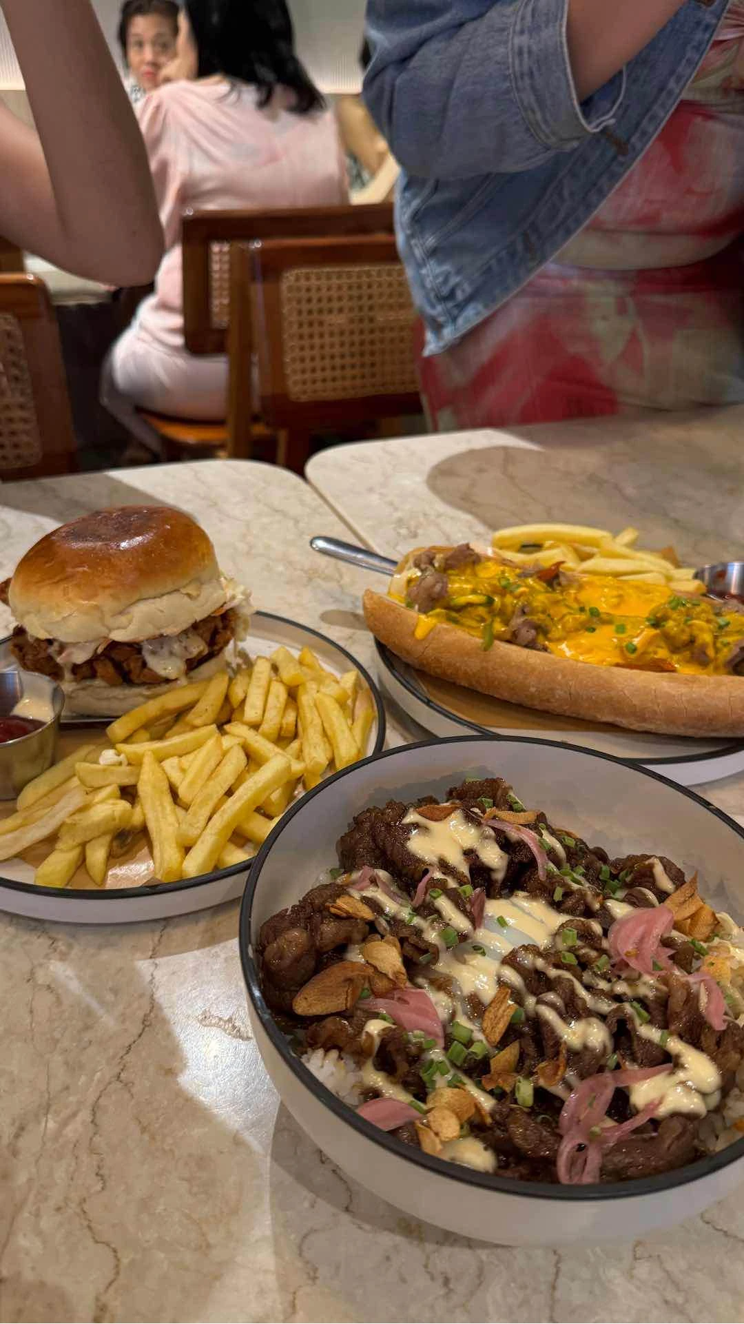 Chicken burger, philly steak, tapa of Sobra Cafe