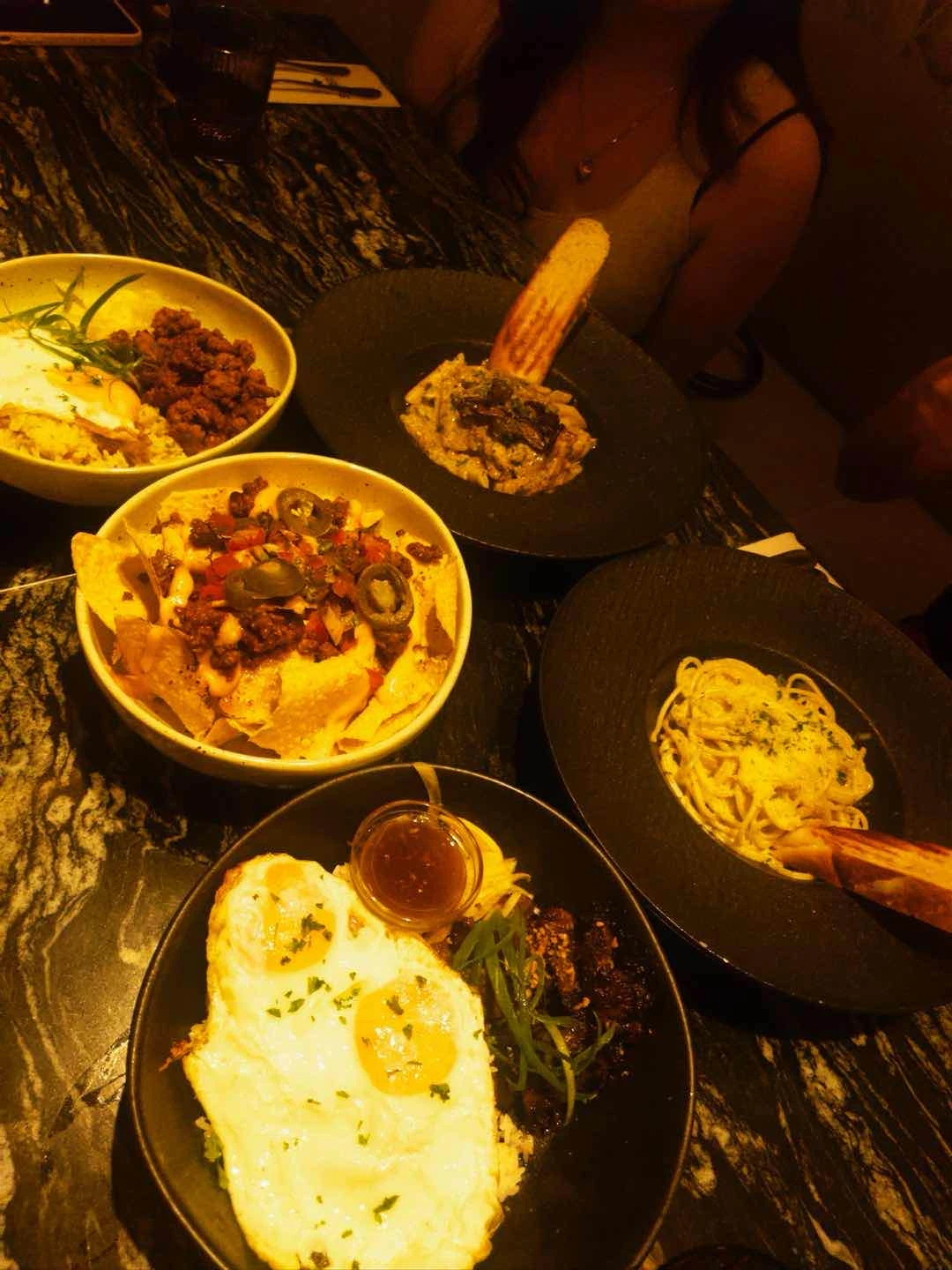 Miso mushroom, truffle pasta, chorizo smth, tapa, nachos of Spotted Pig Rockwell