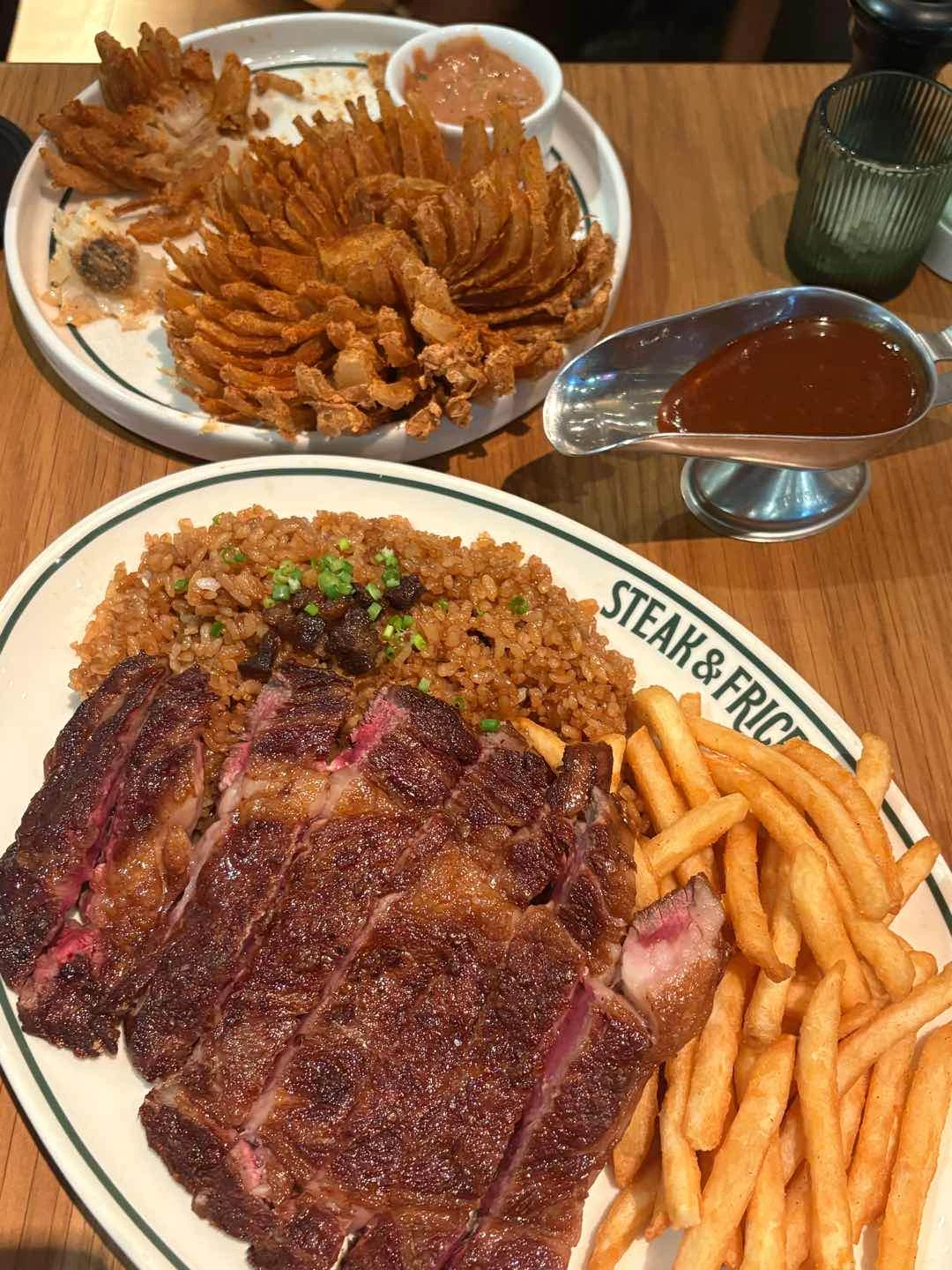 ribeye and onion flower w/ bball sauce of Steak & Frice