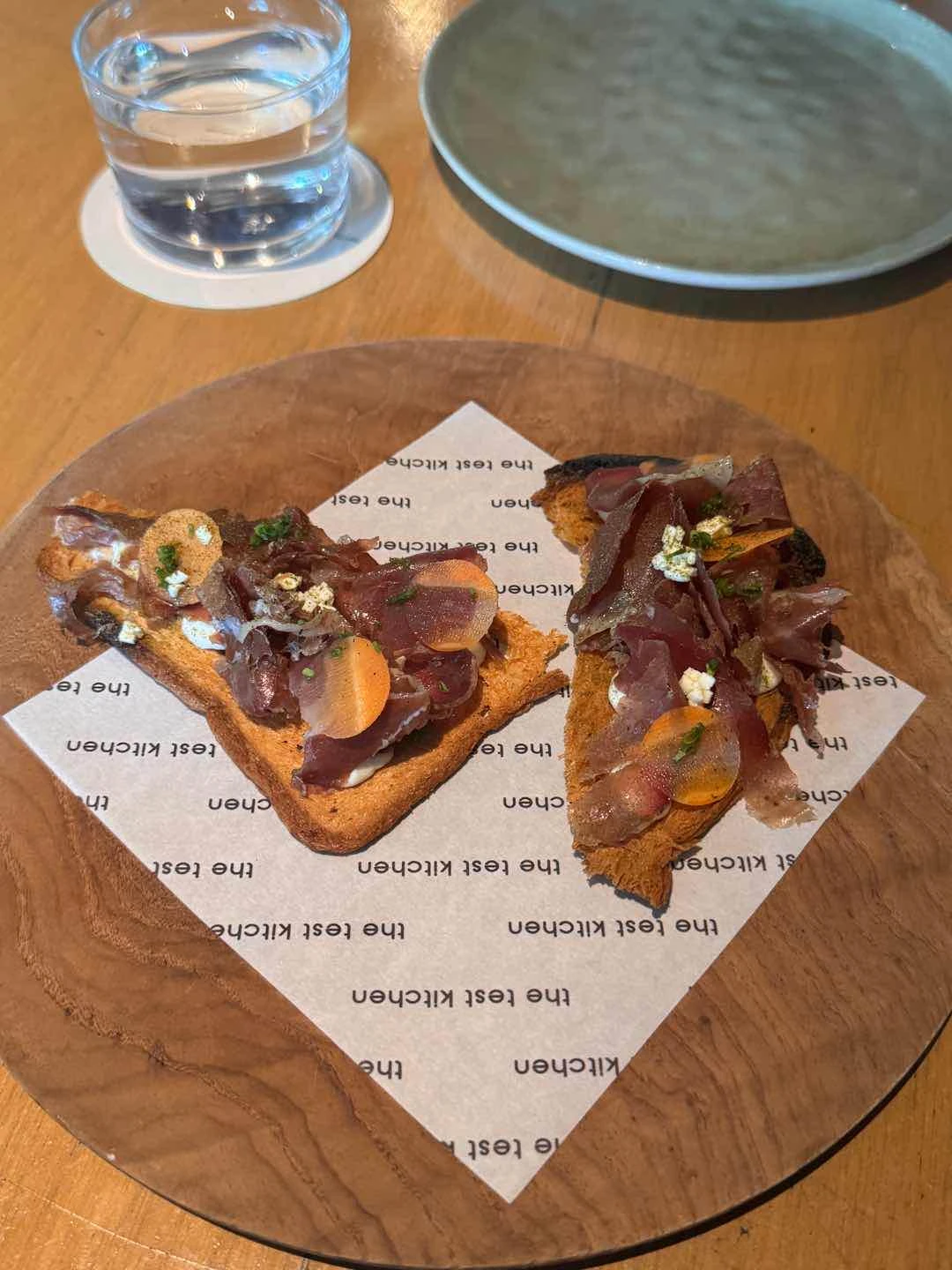 duck prosciutto on toast of The Test Kitchen by Josh Boutwood