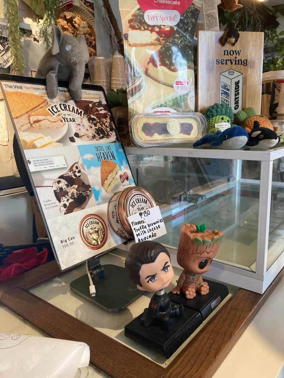 Cute figurines, plushies, and emotional support crochet toys on the counter of Our Humble Beginnings